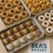 Assorted cookies including thumbprint jam cookies, chocolate chip, powdered sugar, and sprinkles on trays at Bea’s Bakery.