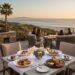 Luxury coastal dining at Catalina Kitchen, Terranea Resort. Sunset dinner on an ocean-view patio with seafood dishes and champagne.