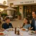 Family of four dining outdoors at The Terrace restaurant at The Maybourne Beverly Hills, enjoying pasta dishes at sunset.