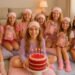 Group of girls in matching pajamas and sleep masks celebrating a birthday sleepover party with cake and gift bags.