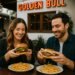 Couple enjoying cocktails and dinner at The Golden Bull steakhouse in Santa Monica, a family-friendly restaurant.