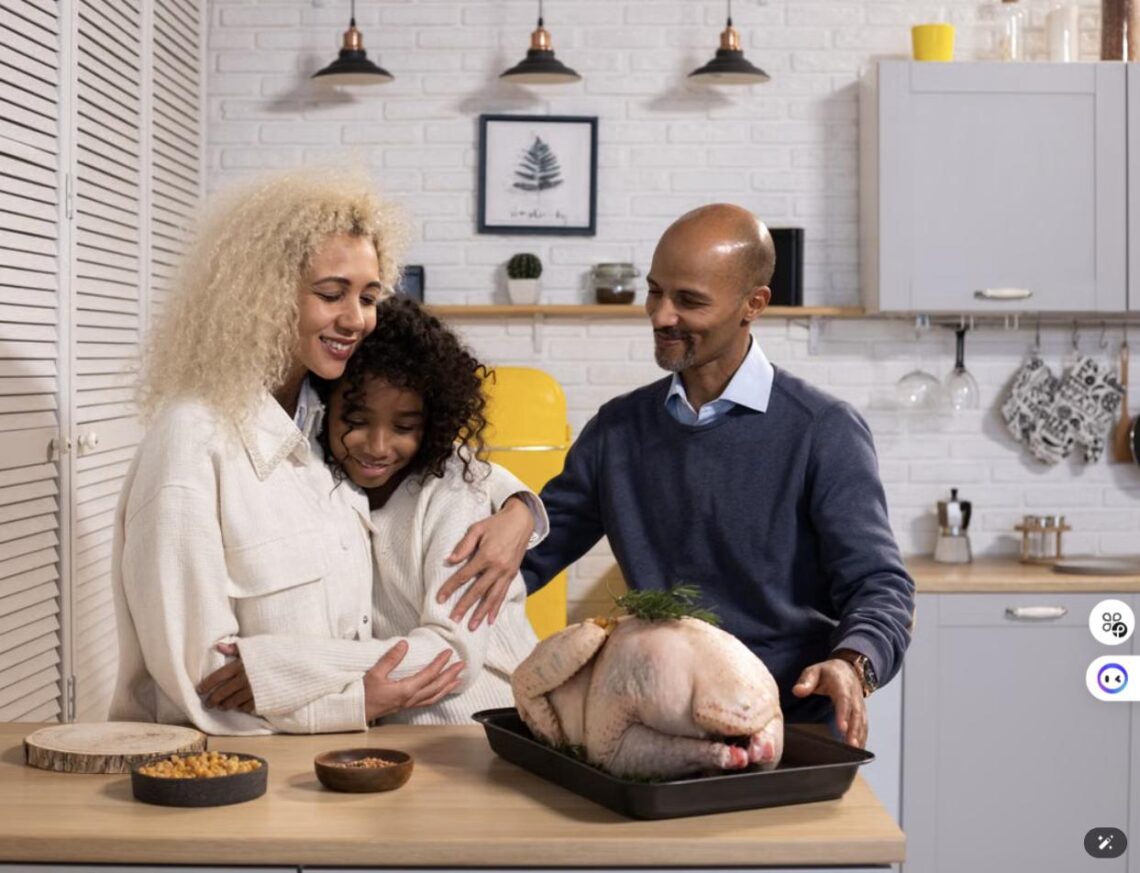 A family gathers around a raw Thanksgiving turkey on the kitchen counter, getting ready to cook.