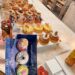 A vibrant display of luxury donuts and cruffins at Donutique in The Venetian Las Vegas, featuring gold-leaf accents, fresh berries, and artisan glazes on a marble counter.