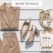 A high-end flat lay of luxury cruise essentials including tan linen trousers, a gold metallic block heel, a silk designer headscarf, and high-end travel skincare on a white wooden deck.