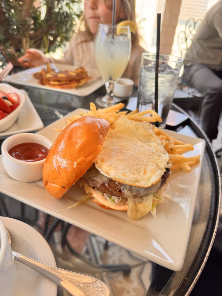 Weekend brunch at Perch LA featuring the signature breakfast burger with a fried egg, fries, and fresh lemonade, enjoyed during a family outing in Downtown Los Angeles.