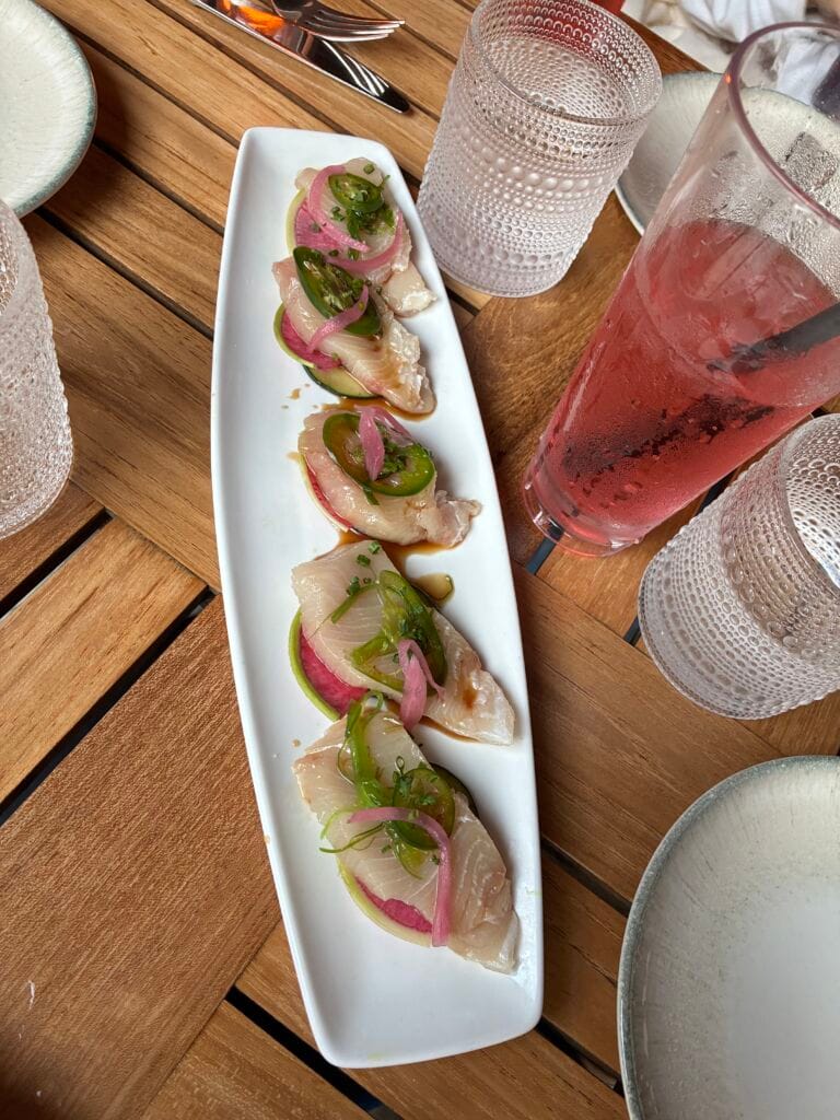 Yellowtail crudo with ginger ponzu, Persian cucumber, watermelon radish, pickled red onion, and serrano peppers at Shoreside Restaurant and Bar in Santa Monica
