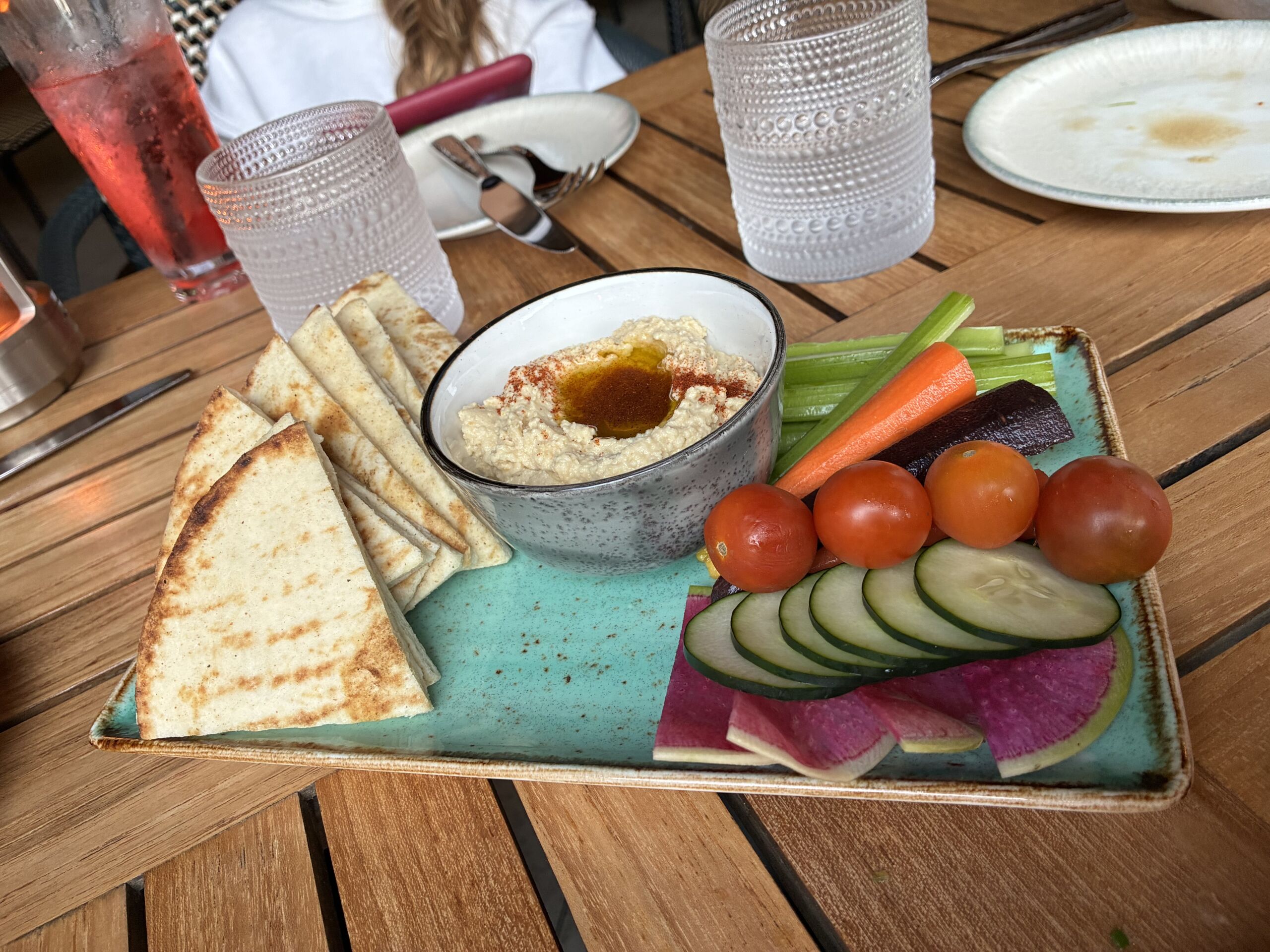 Roasted garlic hummus served with grilled pita and seasonal vegetables at Shoreside Restaurant and Bar in Santa Monica