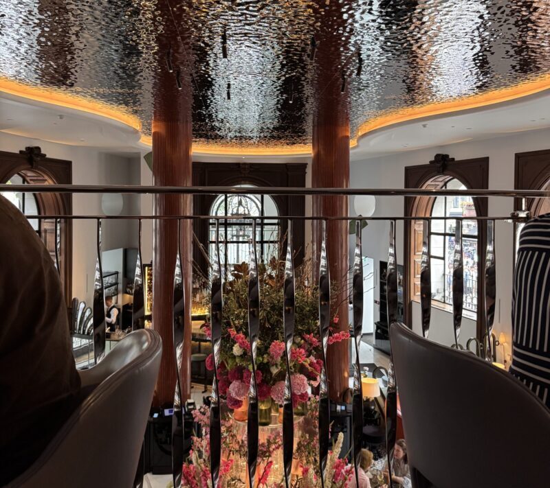 A view inside the Indigo Restaurant at One Aldwych, featuring modern, stylish decor with warm lighting, comfortable seating, and an open, airy atmosphere suitable for its 100% gluten-free and dairy-free menu.