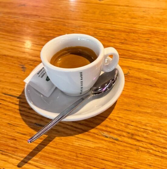 An espresso on a wooden counter at the La Ribera Market in Bilbao