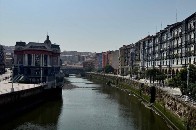 The river running through Bilbao lined with historic buildings