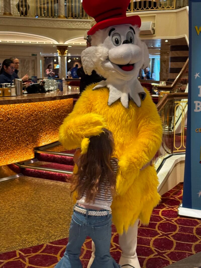 Charlotte hugging Sam-I-Am before the Green Eggs and Ham Breakfast on Carnival Firenze