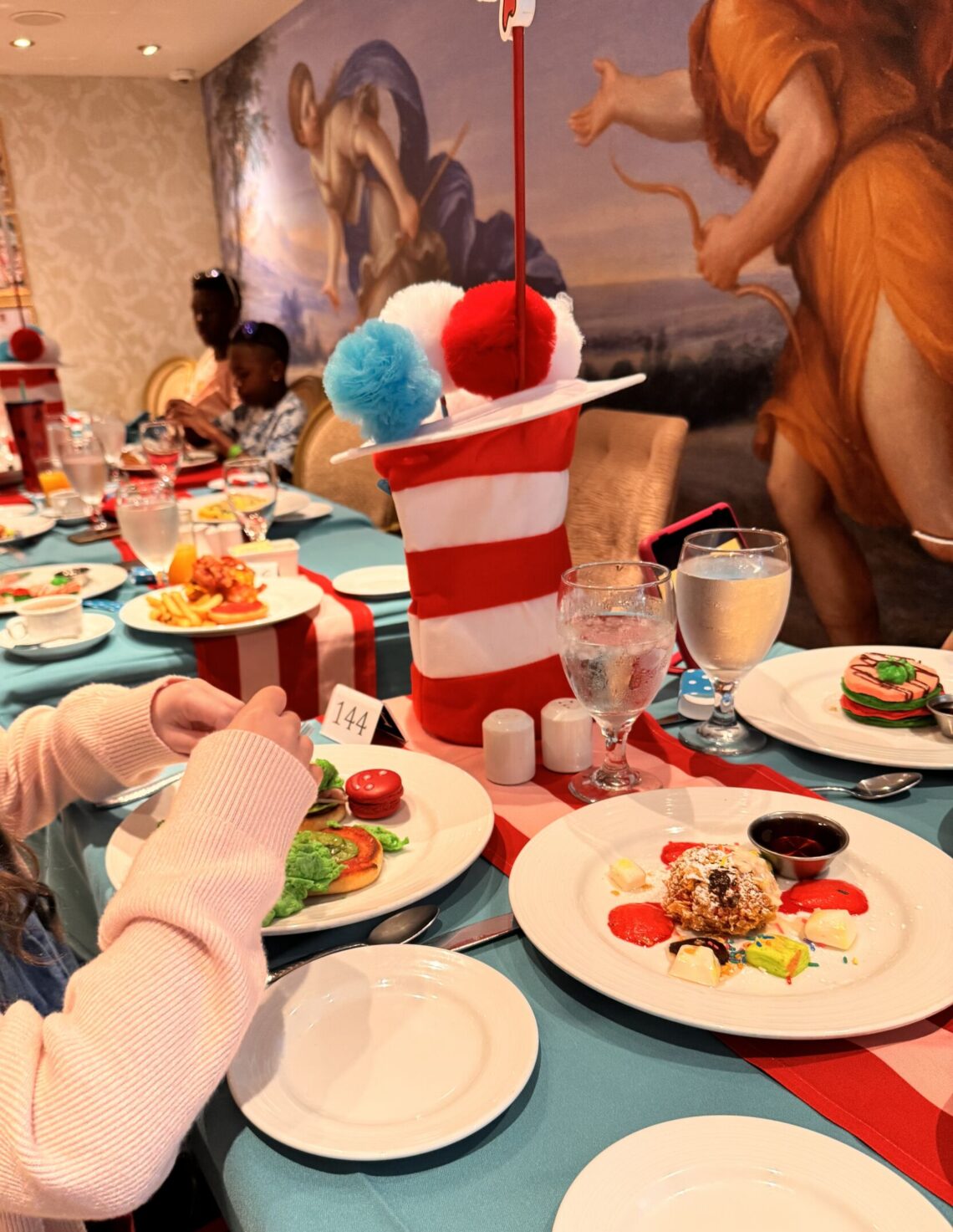 Dr. Seuss Thing 1 and Thing 2 Birthday Breakfast spread on Carnival Firenze, with Green Eggs and Ham, Who-Ville Red Velvet French Toast, and Grinch's Pancakes