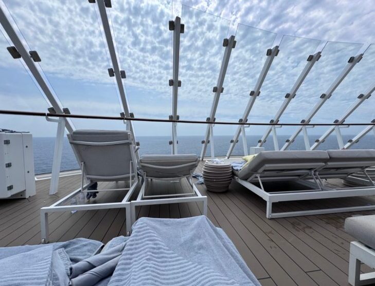Lounge chairs on the Sundeck in The Retreat on Celebrity Apex