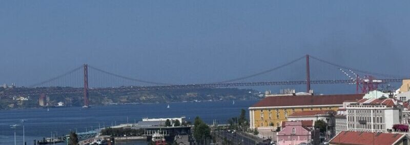 The red 25 de Abril suspension bridge over the Tagus River in Lisbon