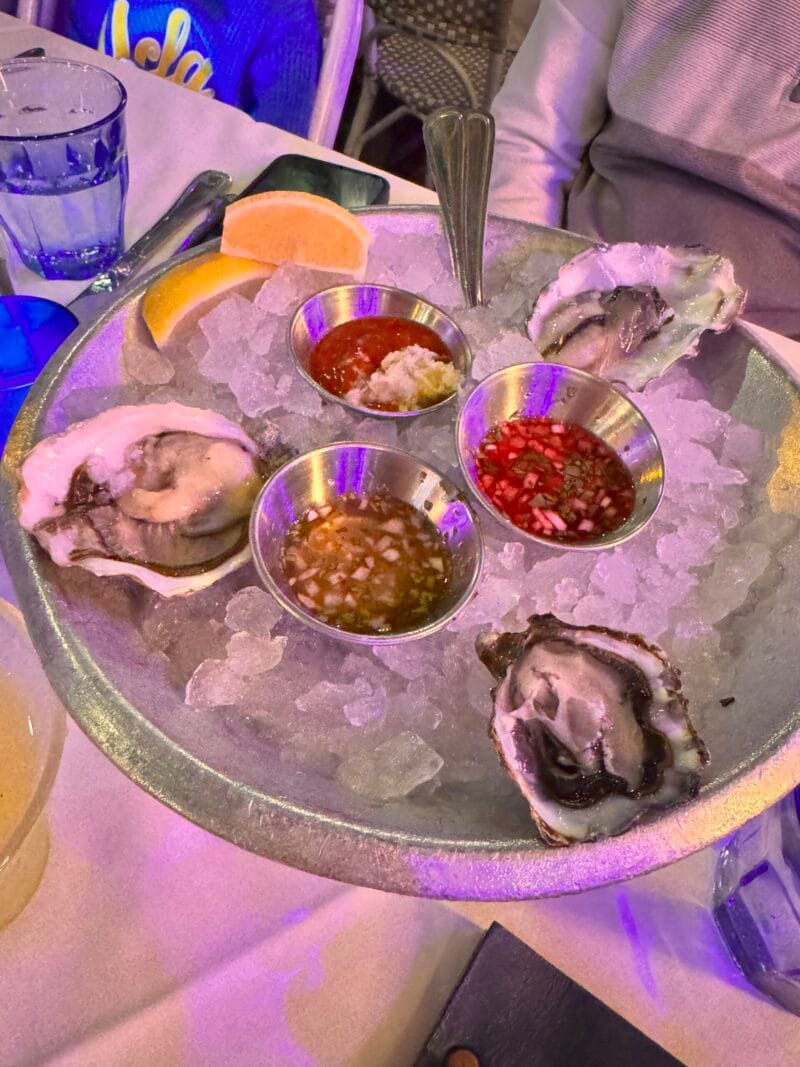 West Coast oysters on ice at Blue Plate Oysterette, including Minter Sweet, Phantom Creek, and Kumamoto oysters with mignonette sauces