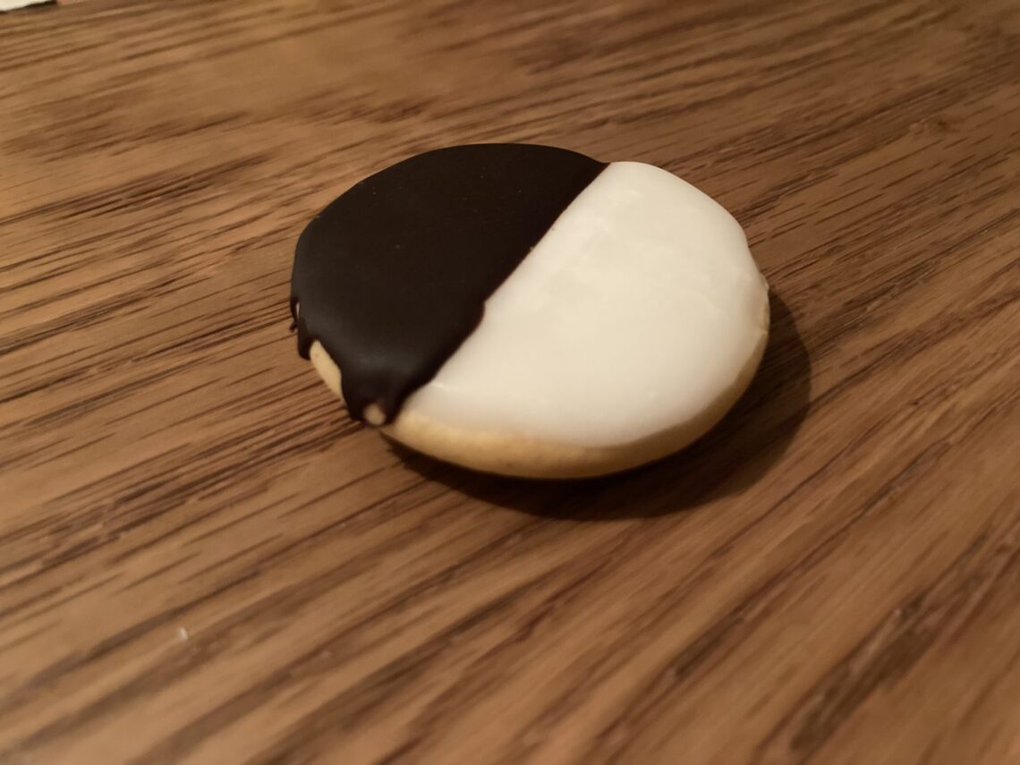 A classic black-and-white cookie, half chocolate and half vanilla icing, the Jewish-American bakery specialty Bea's Bakery is known for.