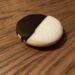 A classic black-and-white cookie, half chocolate and half vanilla icing, the Jewish-American bakery specialty Bea's Bakery is known for.