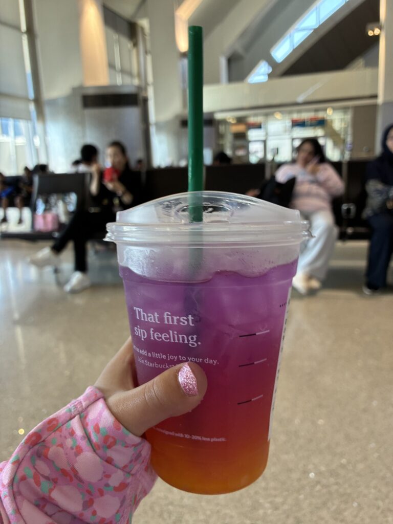 Starbucks drink at the LAX gate before a Virgin Atlantic flight