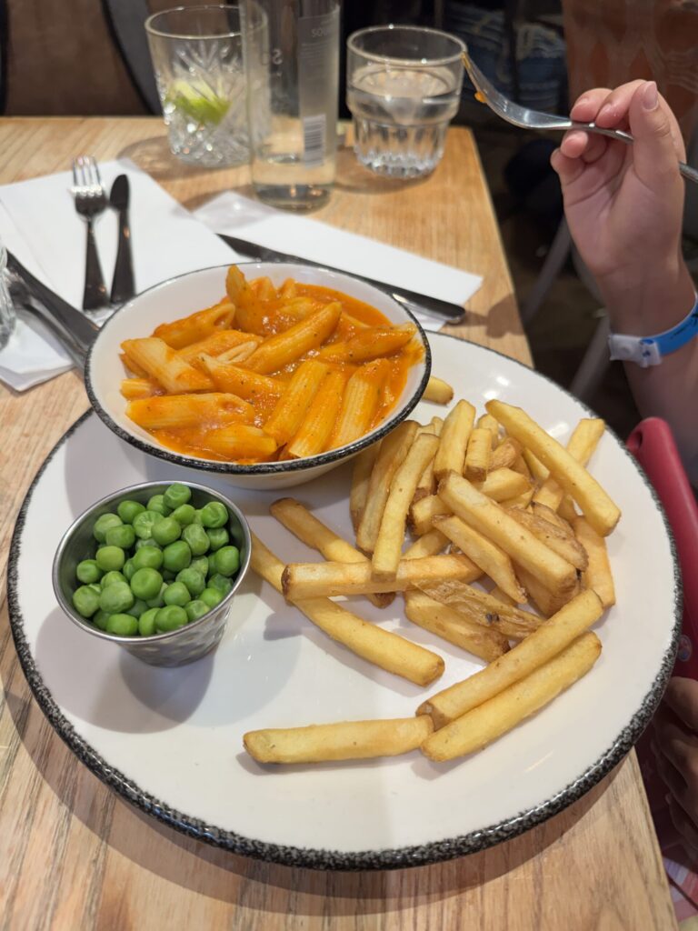 Kids' pasta with peas and fries at The Curator, Heathrow Airport