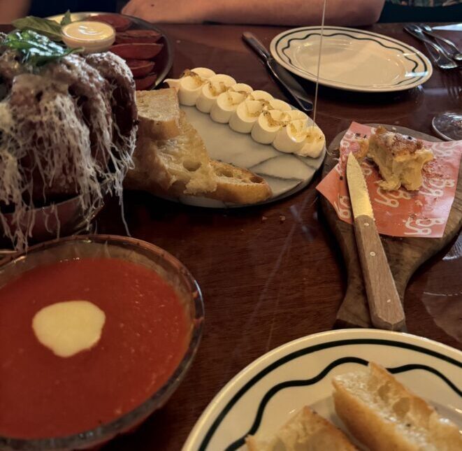 Starters at Bad Roman including Eggplant Pull-a-Parm with marinara, Whipped Ricotta with Truffle Honey, and 'Roni Cups with ranch.