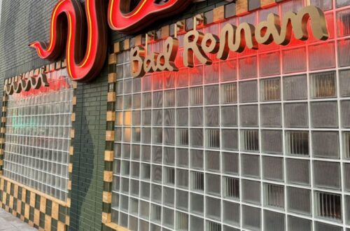Outside view of Bad Roman restaurant in Beverly Hills, showcasing its stylish entrance and inviting facade.