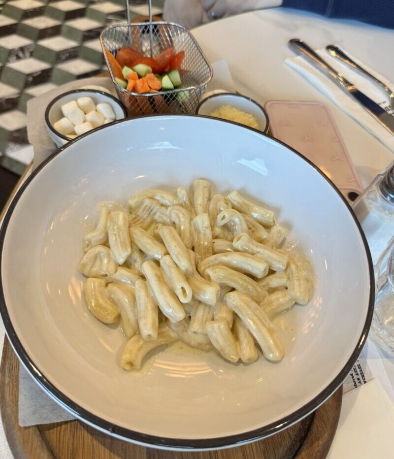 Pasta Alfredo from the kids' menu served with a side of veggies and marshmallows at Cafe Landwer in Brentwood.