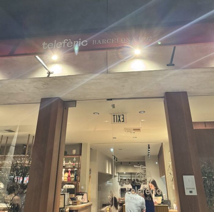 A charming view of Telefèric Barcelona restaurant in Brentwood, showcasing its inviting atmosphere and indoor seating.