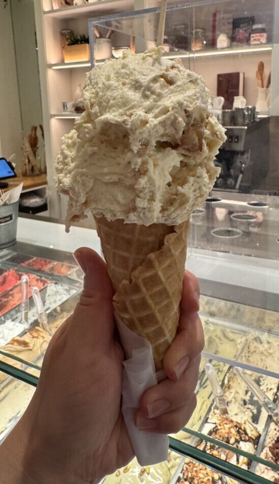 A delectable serving of limited edition Apple Crumble gelato from Bacio di Latte in Brentwood, LA, showcasing its creamy texture and toppings.