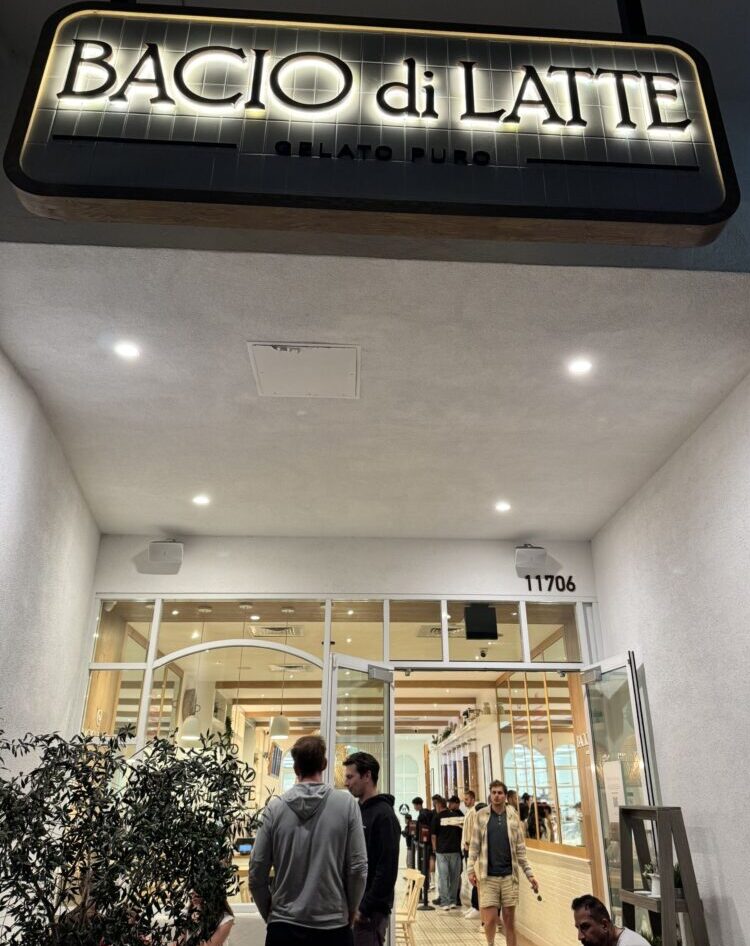A charming exterior view of Bacio di Latte gelato shop in Brentwood, LA, featuring its inviting entrance and outdoor seating area.