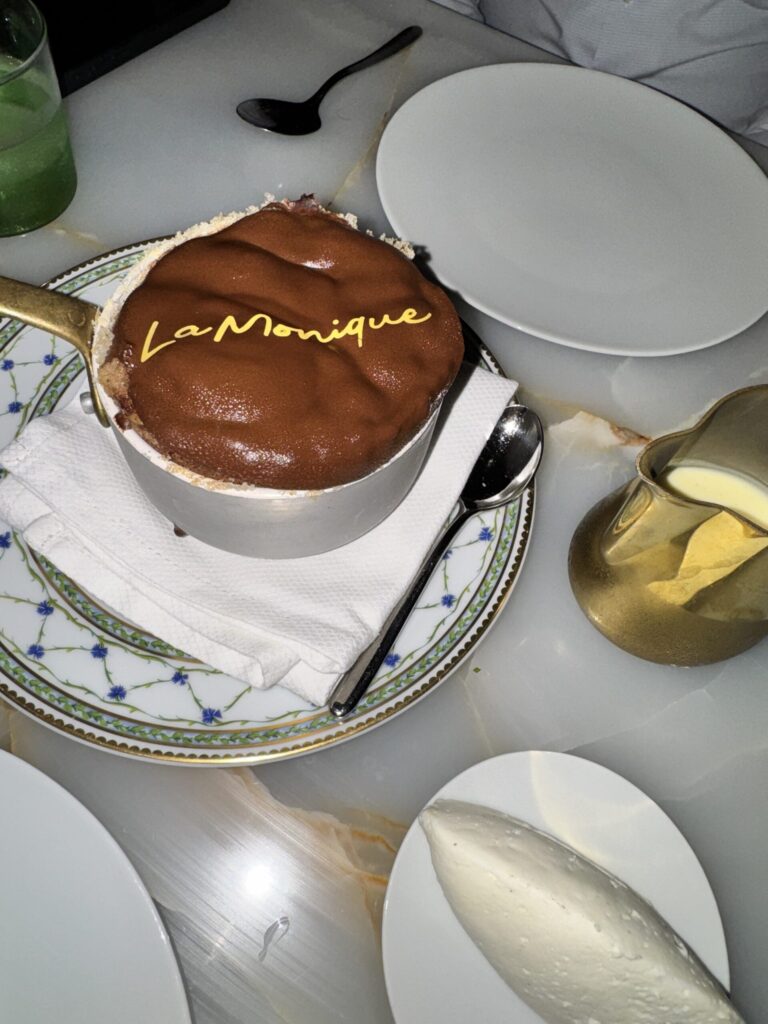 Chocolate soufflé at La Monique Santa Monica with the restaurant name piped in gold