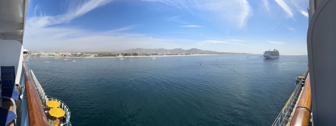 View from a balcony aboard the Carnival Firenze overlooking the coastline and beach of Cabo San Lucas, Mexico