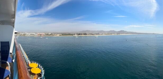 View from a balcony aboard the Carnival Firenze overlooking the coastline and beach of Cabo San Lucas, Mexico
