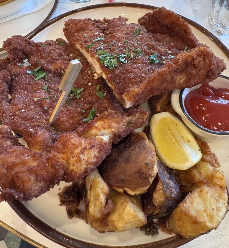 Delicious Landwer's Famous Schnitzel (Kosher Style) served with potatoes instead of French fries.