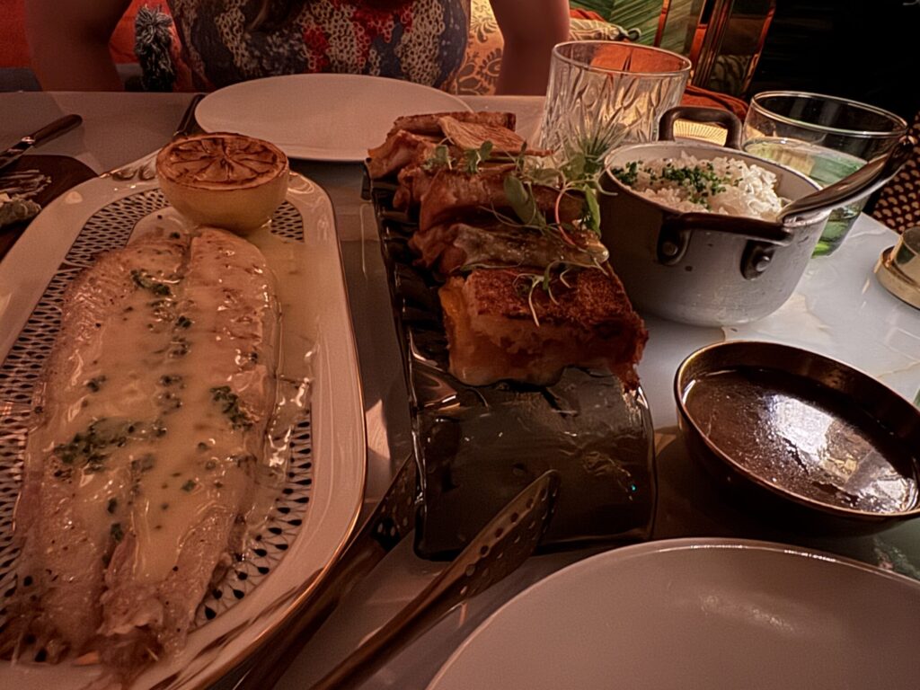 Dover sole with beurre blanc at La Monique Santa Monica, next to mini French onion grilled cheese