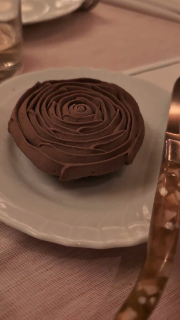 Rich chocolate tart with piped chocolate rose