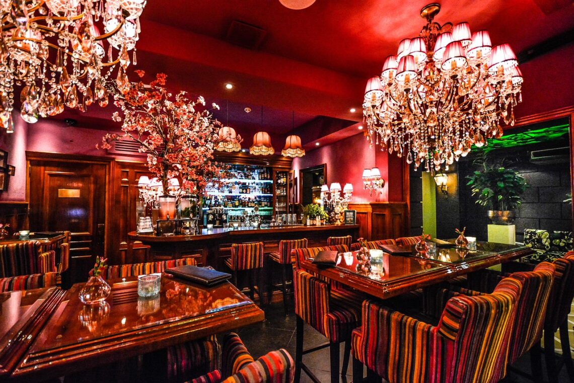 A jewel-toned, Old Hollywood-style restaurant interior evoking the mood of a La Monique Valentine's Day dinner at Oceana Santa Monica