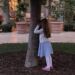 Madeline playing hide-and-seek by a tree in the courtyard at The Terrace at The Maybourne while we waited for dinner