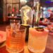 Calvados Old Fashioned and a Mezcalita D’Ananas garnished with jalapeño on the table at Massilia in Santa Monica