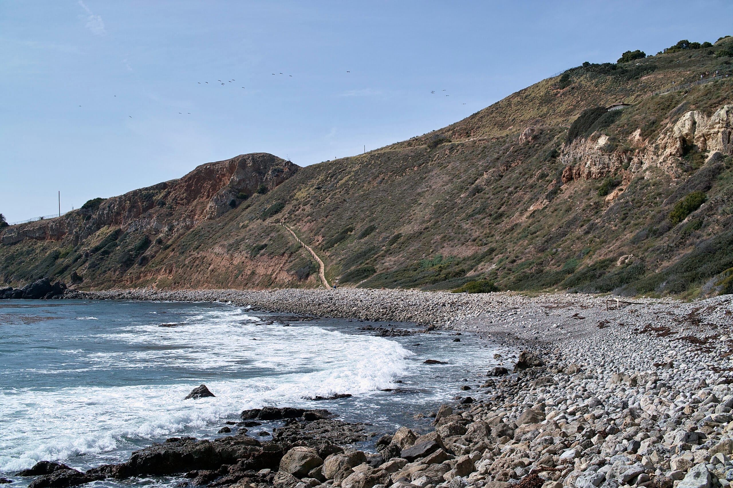 Rugged coastal bluffs and the Pacific Ocean along the Palos Verdes Peninsula, near where Nelson's at Terranea sits.