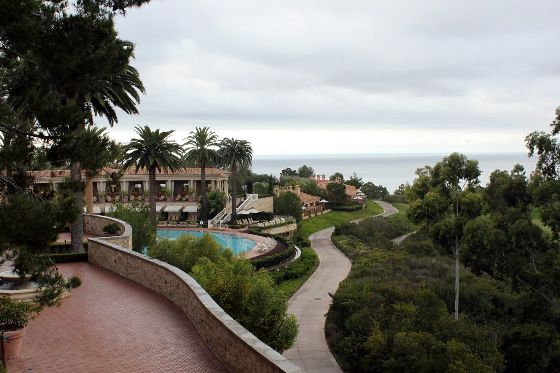 Walkway and pool at The Resort at Pelican Hill overlooking the Pacific in Newport Coast