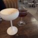 Minoan Sour with egg white foam and an Ankara Rye Club cocktail on the table at Zaytinya