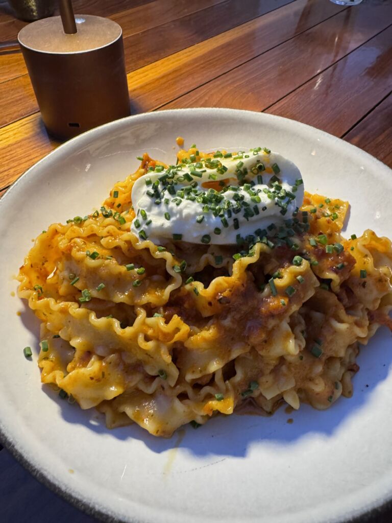 Malfadine pasta with sun-dried tomatoes topped with a scoop of bocconcini and chives at Marelle in Santa Monica