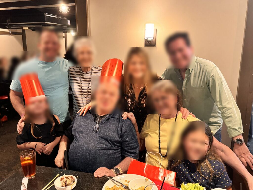 Family group in Benihana chef hats at Benihana Encino