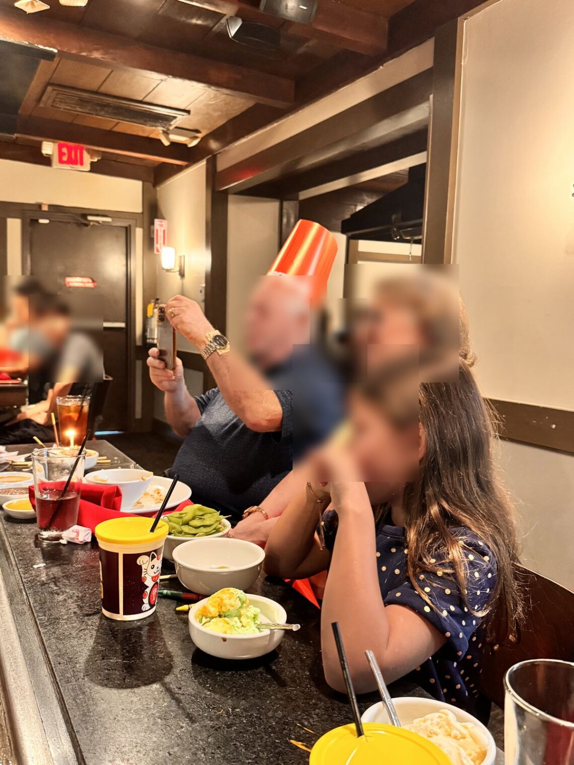 Family watching the chef at a hibachi table at Benihana Encino