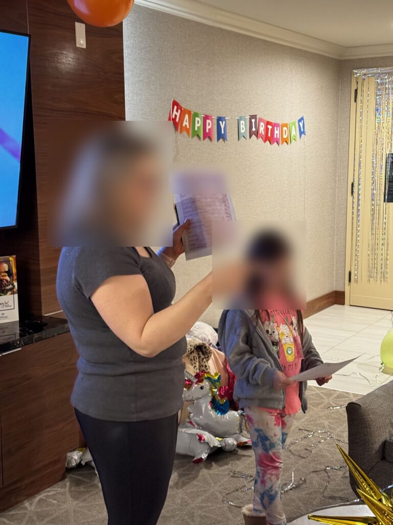 Mom and daughter explaining the hotel scavenger hunt in the party suite
