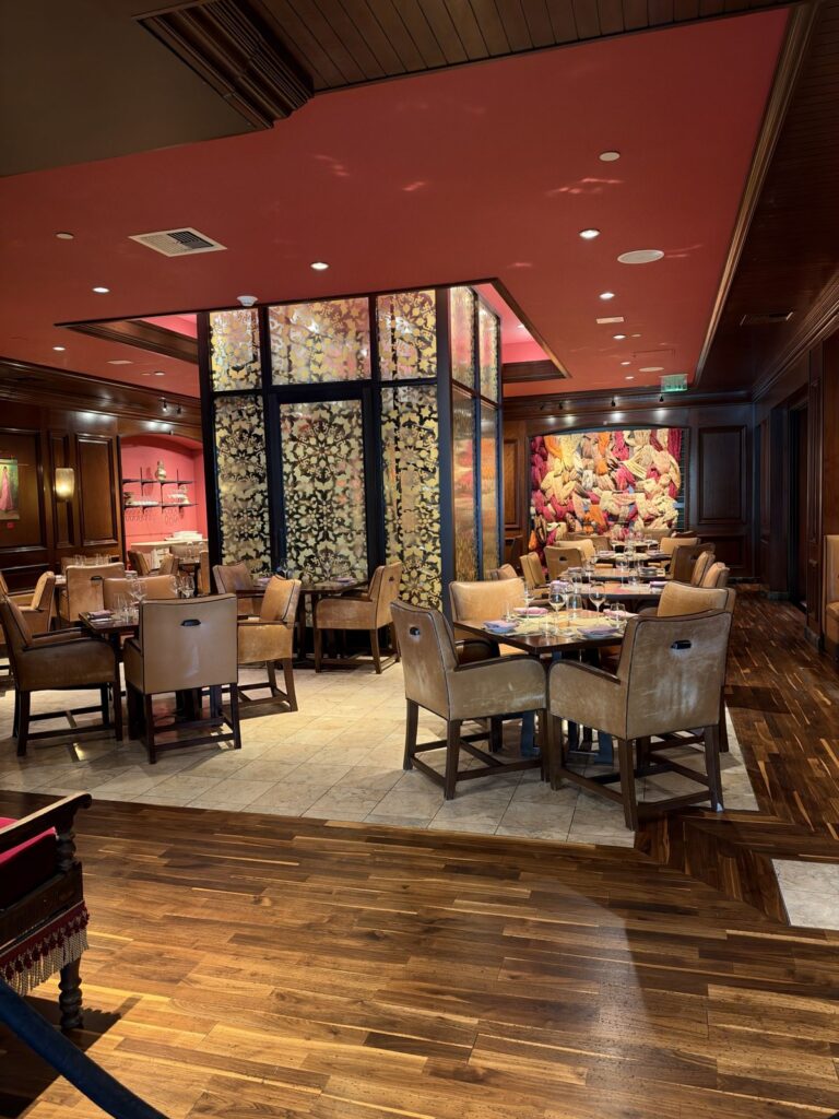 Kahani dining room with red ceiling and carved screens at the Ritz-Carlton Laguna Niguel