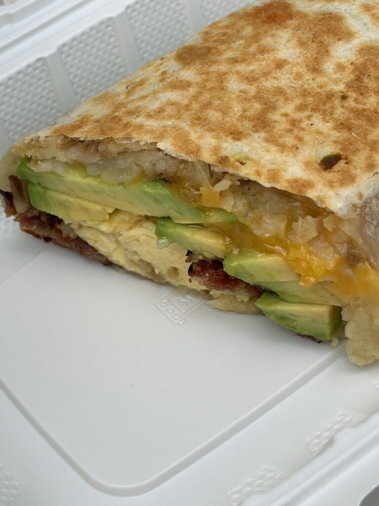 Laguna Burrito with eggs, bacon, avocado and cheese from The Market Place