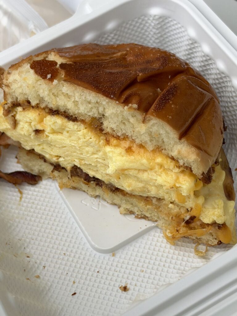 Surf's Up breakfast sandwich with eggs and cheese on a pretzel bun from The Market Place