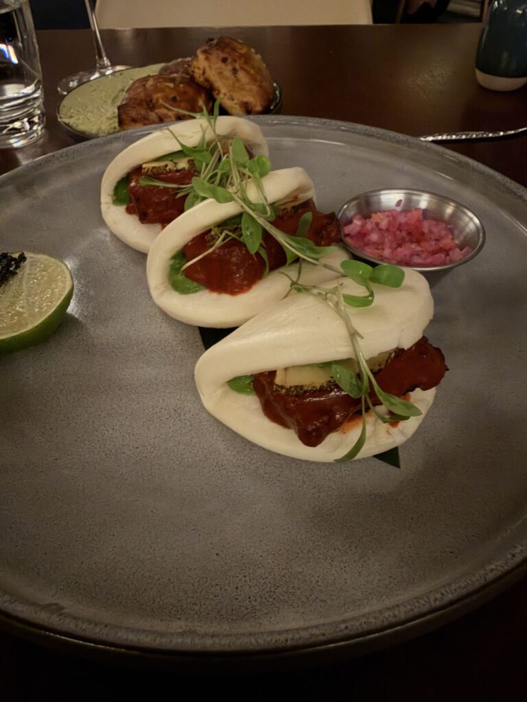 Al pastor bao buns with pickled onions at Raya, Ritz-Carlton Laguna Niguel