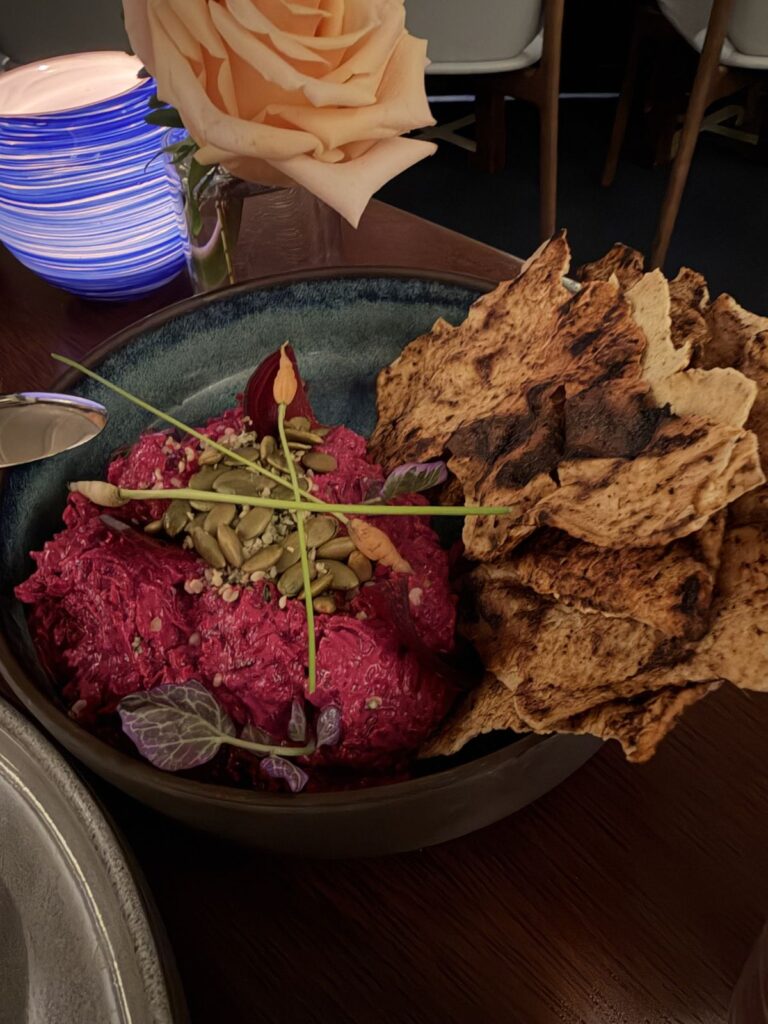 Beet root hummus with pumpkin seeds and flatbread crisps at Raya
